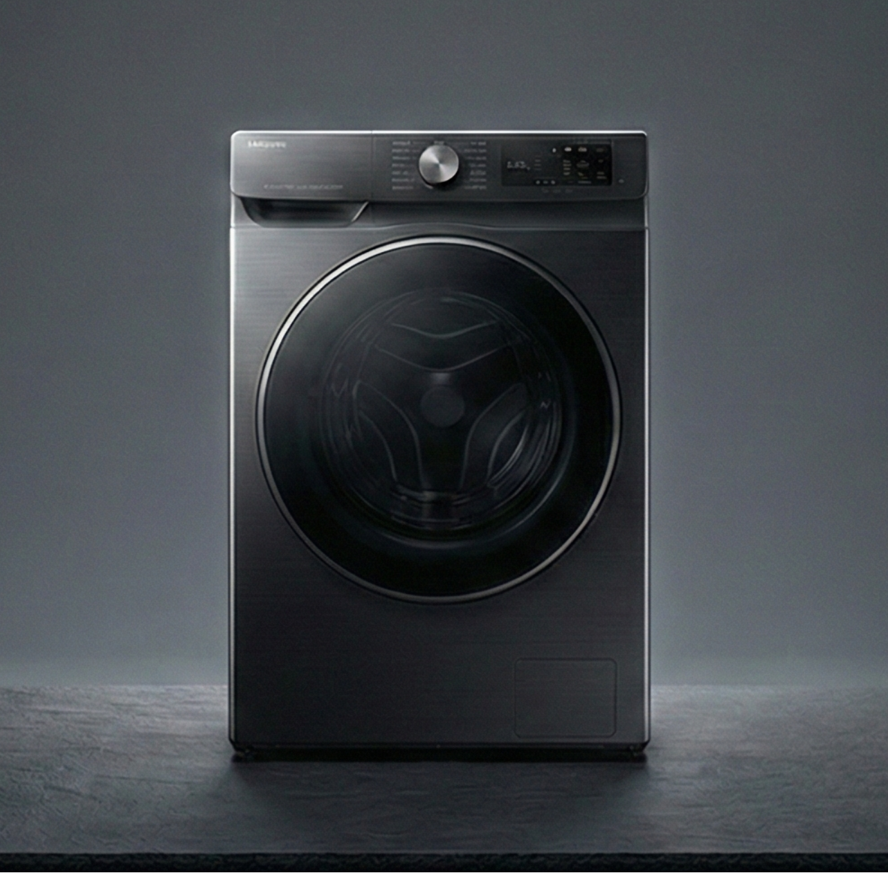 Black washing machine on a dark gray background