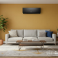 Gree Air Conditioner in Mustard Living Room with DARCOM Logo
