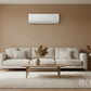 Sharp Air Conditioner in Tan Living Room with DARCOM Logo